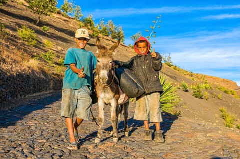 Children with donkey on path. Fogo. Cabo Verde. Africa
