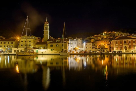 Church of St. Jerome of Stridon and sailboats at night, Pucišca, Split-Dalmatia County, Croatia,
