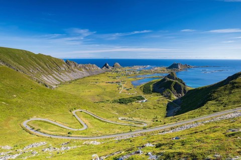 Coast and mountains, view of the village of Sørland on the island of Værøy, Vaeroy, Lofoten,