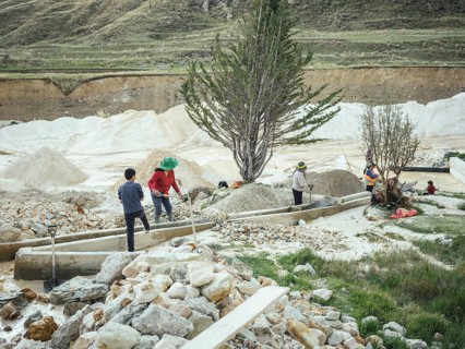 A young man and three woman work in a kaolin mine, Pachacayo, Peru, South America