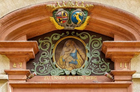 Depiction of Mary with the Child Jesus on the portal gable of the house Zu Unser Frauen Berg,