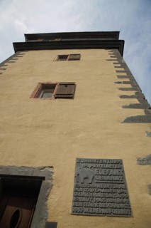 Historic cowherd's defence tower the elephant with view upwards and information board, fortified