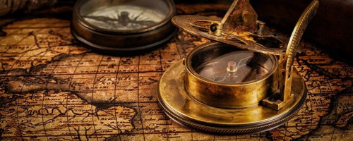 Travel geography navigation concept background, letterbox panorama of old vintage retro compass