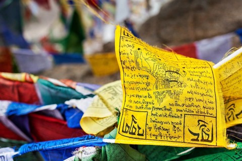 Tibetan Buddhism prayer flags (lungta) with Om Mani Padme Hum Buddhist mantra prayer. Leh, Ladakh,