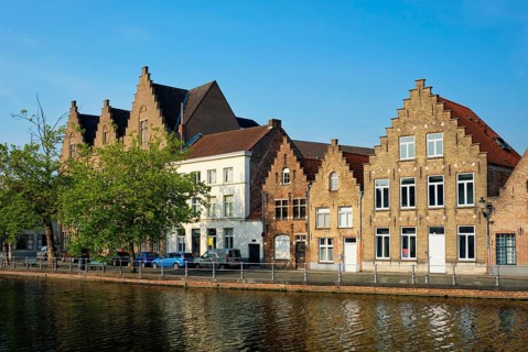 Typical Belgian cityscape Europe tourism concept, canal and old houses on sunset. Bruges (Brugge),