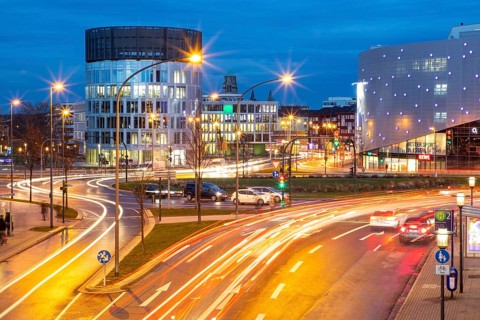 Evening city traffic in Essen, Germany, large intersection, roundabout, Berliner Platz, Berlin