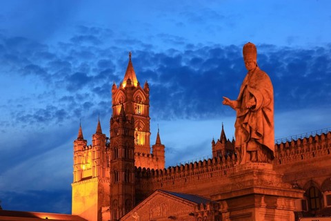 In the old town of Palermo, statue of the saint in front of the Cathedral Maria Santissima Assunta,