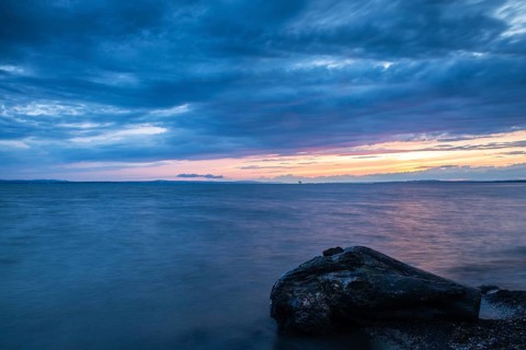 Blue hour at Lake Constance, clouds, water, shore, dead wood, summer, Langenargen,