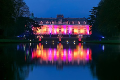 Illuminated Benrath Palace in the evening with the mirror pond at Christmas Wunderwelt, Düsseldorf,