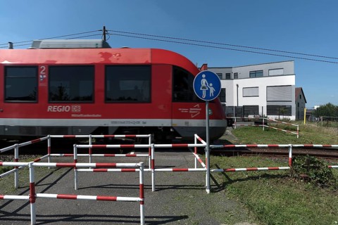 Suburban railway crossing an ungated pedestrian crossing, Eckental Middle Franconia, Bavaria,