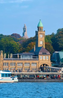 St. Pauli Landing Bridges on the River Elbe, with the Bismarck Monument in the background, Hamburg,