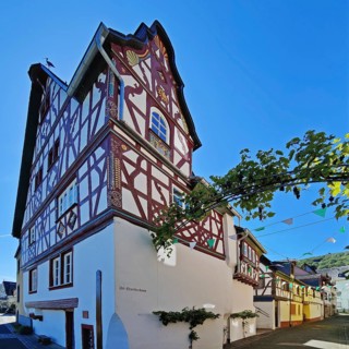Stork house half-timbered house with wine arch, Bremm, Rhineland-Palatinate, Germany, Europe