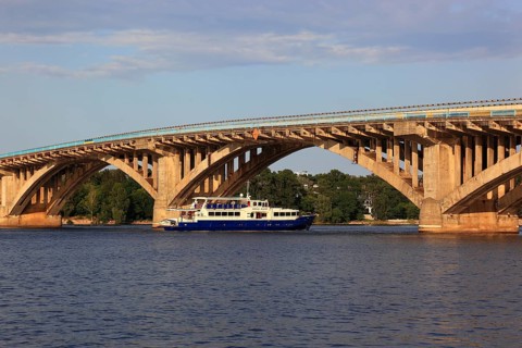 Bridge over the Dnieper River and a pleasure boat, Kiev, Ukraine, Europe