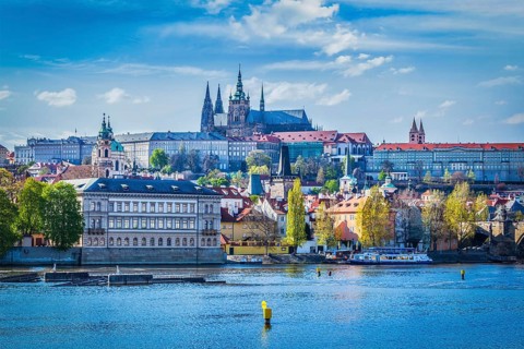 View of Gradchany Prague Castle and St. Vitus Cathedral in daytime over Vltava river