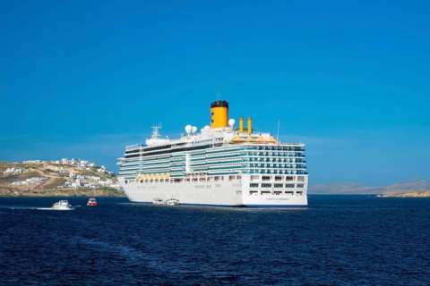 MYKONOS, GREECE, MAY 29, 2019: Cruise liner ship Costa Luminosa in Mediterranea sea near Mykonos