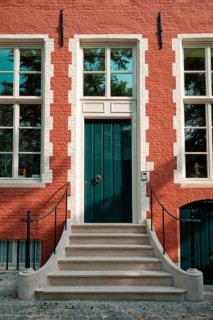 Brugge door with doorstep and window of an old Eurupean house. Bruges, Belgium, Europe