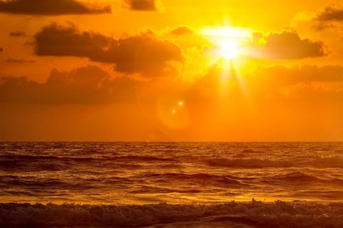 Ocean sunset at Baga beach. Goa, India, Asia
