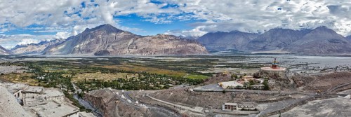 Panorama of Nubra valley in Himalayas with giant Buddha statue in Diskit, Ladakh, India, Asia