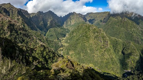 Densely overgrown steep mountains, green mountain landscape, view from the Miradouro dos Balcões,
