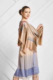 Cheerful woman with silk scarf posing in profile