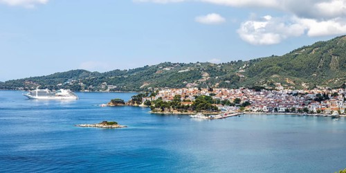 Skiathos town with cruise ship holiday by the sea panorama on the Mediterranean island of Skiathos,