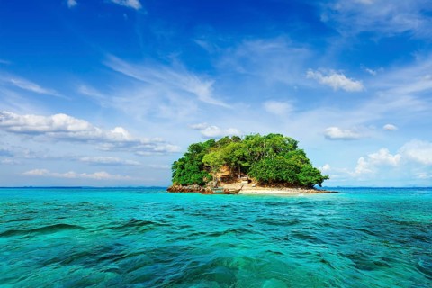 Vacation holidays concept background, tropical island and long-tail boat in sea. Thailand