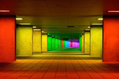 Colorful mulitcolord illuminated gallery tunnel rainbow passage under NAI building, Nederlands