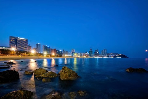 Haeundae beach in Busan at night with illuminated skyscrapers, Busan, South Korea, Asia