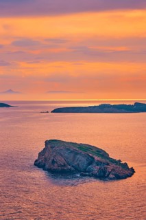 Aegean Sea with Greek islands view on sunset. Cape Sounion, Greece, Europe