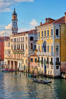 VENICE, ITALY, JUNE 27, 2018: Grand Canal with boats and gondolas on sunset, Venice, Italy, Europe