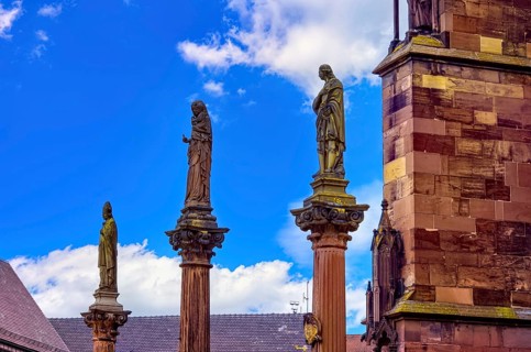 Plague pillars with patron saints in front of the main portal of Freiburg Cathedral on Münsterplatz