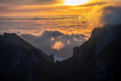 Sunrise, sun shining over mountains in fog, Säntis, Appenzell Ausserrhoden, Appenzell Alps,