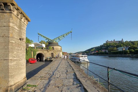 River promenade with historic city fortifications with Alter Kranen on the Main and Marienberg
