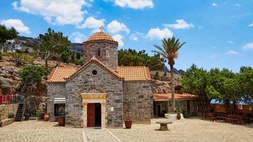 Church, stone building, red tiled roof, dome, palm tree, forecourt, Koudouma, Orthodox monastery,