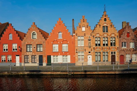 Typical Belgian cityscape Europe tourism concept, canal and old houses on sunset. Bruges (Brugge),