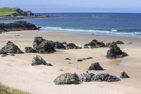 Sandy beach with rocks near Durness, Sutherland, Scottish Highlands, Scotland, UK