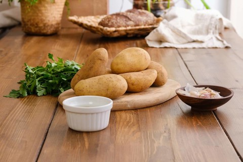 Ingredients for potato pancakes on a table