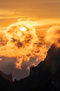 Sunrise, sun shining over mountains in fog, Säntis, Appenzell Ausserrhoden, Appenzell Alps,