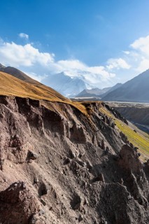 Achik Tash valley between high mountains, mountain landscape with glaciated peak Pik Lenin, Trans
