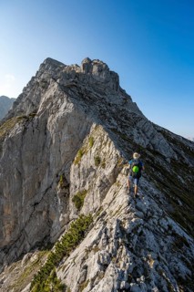 Mountaineer on a narrow ridge, mountain tour to the summit of the Hochkalter, Hochkalter crossing,