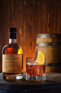 April 8, 2022, Minsk, Belarus, bottle and glass with Monkey Shoulder blended malt scotch whisky