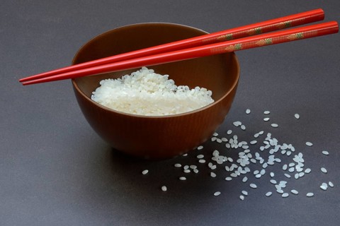 Rice, white rice in bowl with chopsticks, uncooked