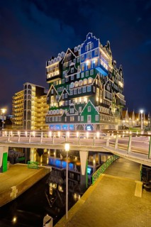 ZAANDAM, NETHERLANDS, MAY 21, 2018: Inntel Hotel in Zaandam illuminated at night. Design of
