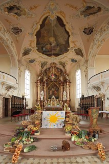 Interior view with altar of baroque magnificent St. Martin Church during harvest festival, harvest