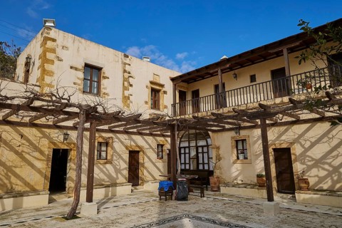 Inner courtyard, grape arbours, building over corner, Panagias, Odigitrias, Gonias, Orthodox