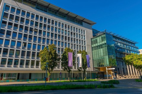 State Labour Court (left) and Stuttgart Stock Exchange (right), flags, street, trees, Stuttgart,