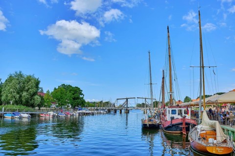 Picturesque view of Greifswald Wieck town harbour with historic wooden bascule bridge over the