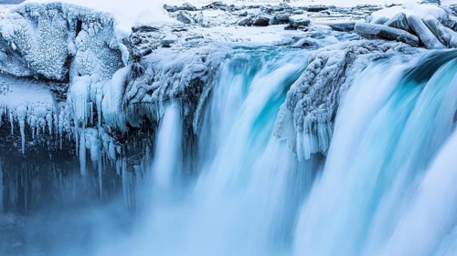 Godafoss waterfall, icy and snowy rock face, Northern Iceland Eyestra, Iceland, Europe