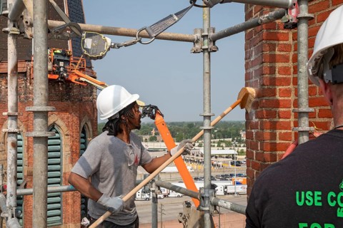 Detroit, Michigan, Anthony Powell cleans the bell towers of the Basilica of Ste. Anne de Detroit.
