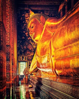 Vintage retro effect filtered hipster style image of reclining Buddha gold statue. Wat Pho,